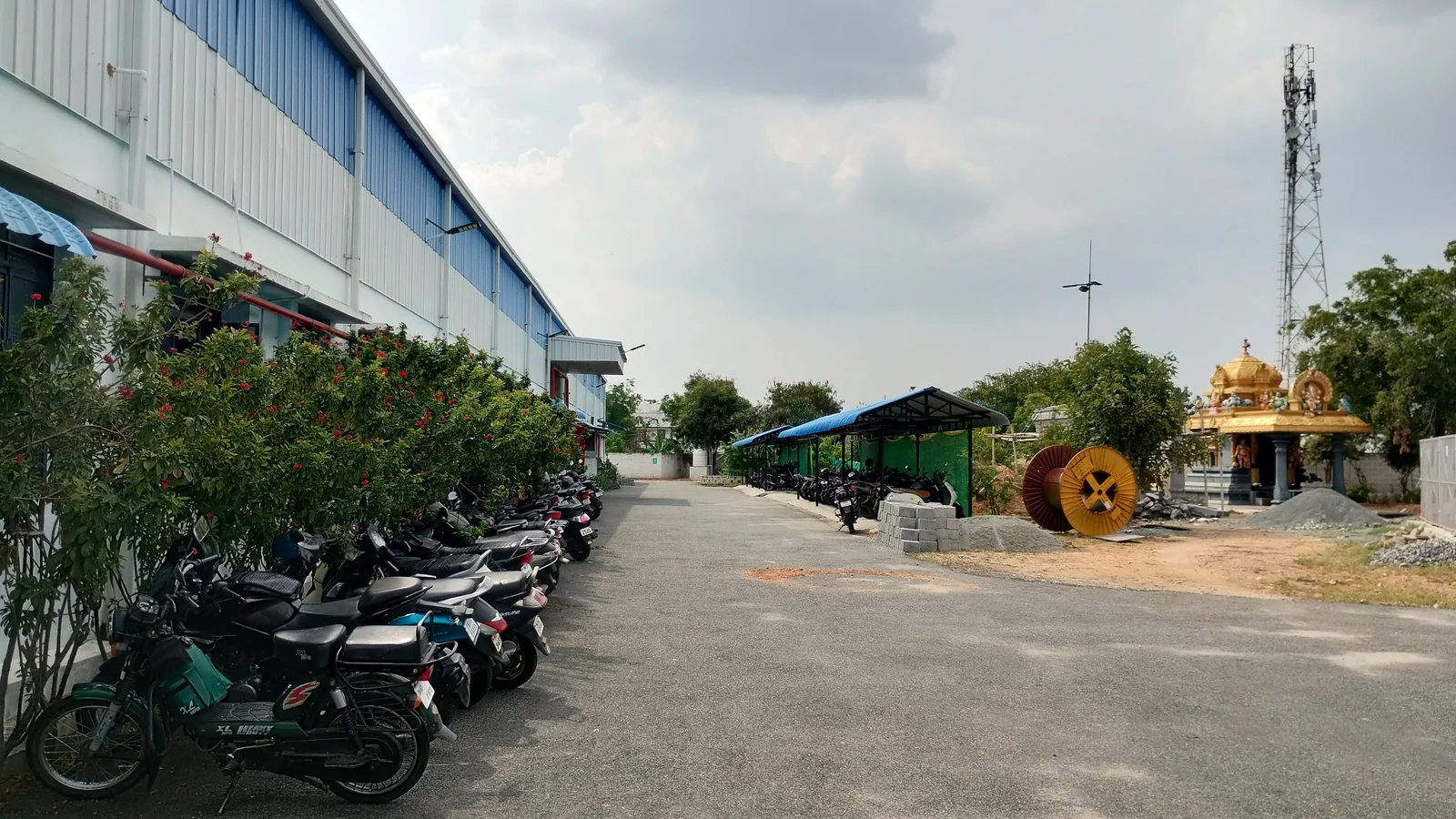 Wide exterior view of Macrofast's GOTS-certified garment and digital textile printing facility in Annur, Tamil Nadu, India
